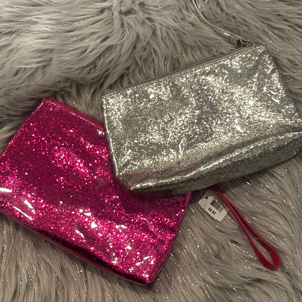 Two glitter make up pouches by bath and Bodyworks
